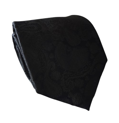 corbata negra tejida sobre tono paisley